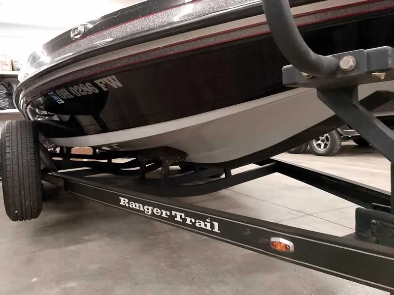 Slide: The Image of 2019 Ranger Z519 DC boat on Ranger Trail trailer in a garage. - 6