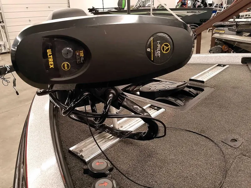 Slide: The Image of 2019 Ranger Z519 DC boat with Ultrex trolling motor in a garage setting. - 8