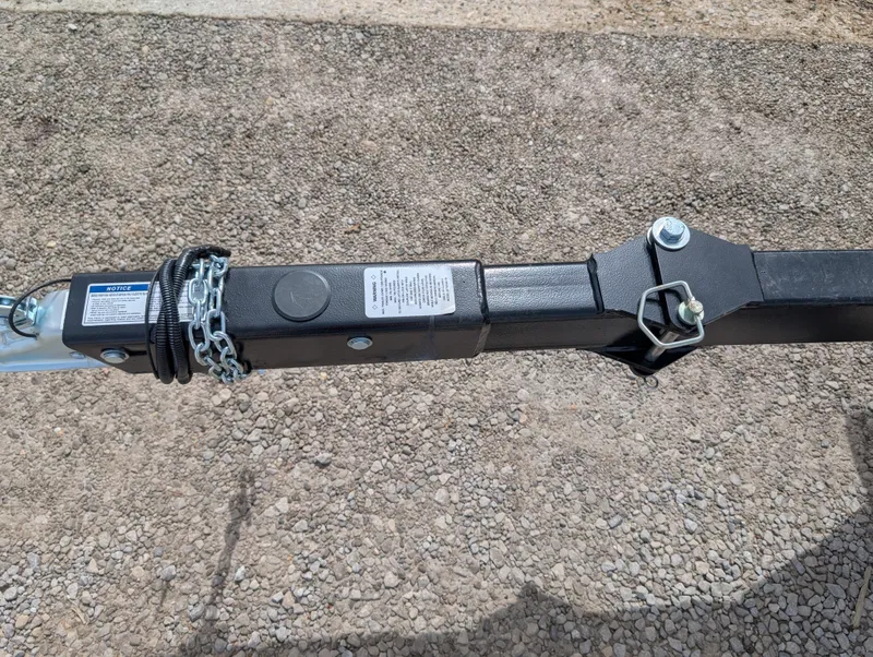 Slide: The Image of Trailer hitch of a 2025 Manitou Cruise on gravel surface. - 11