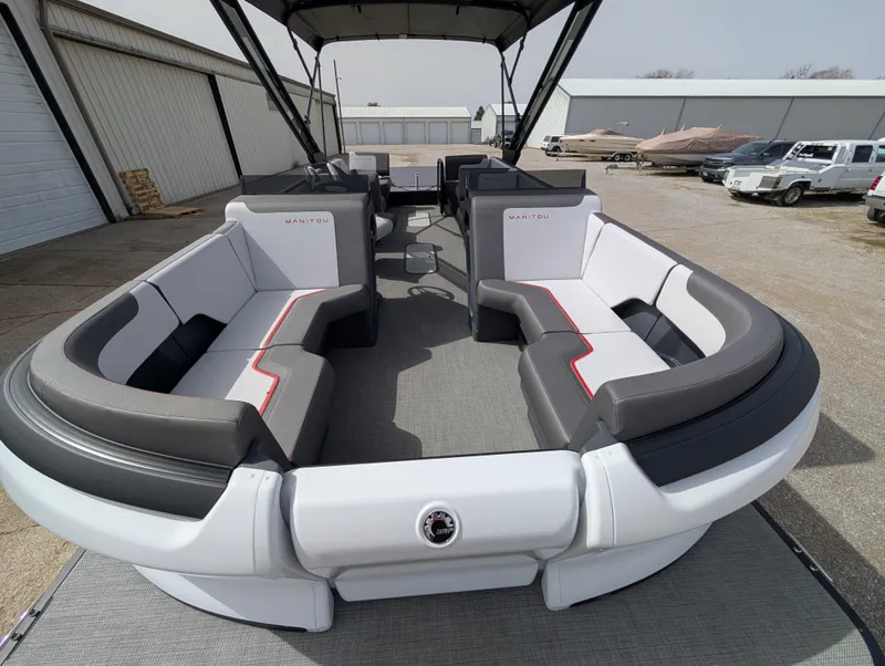 Slide: The Image of 2025 Manitou Cruise pontoon boat with spacious seating and modern design. - 13