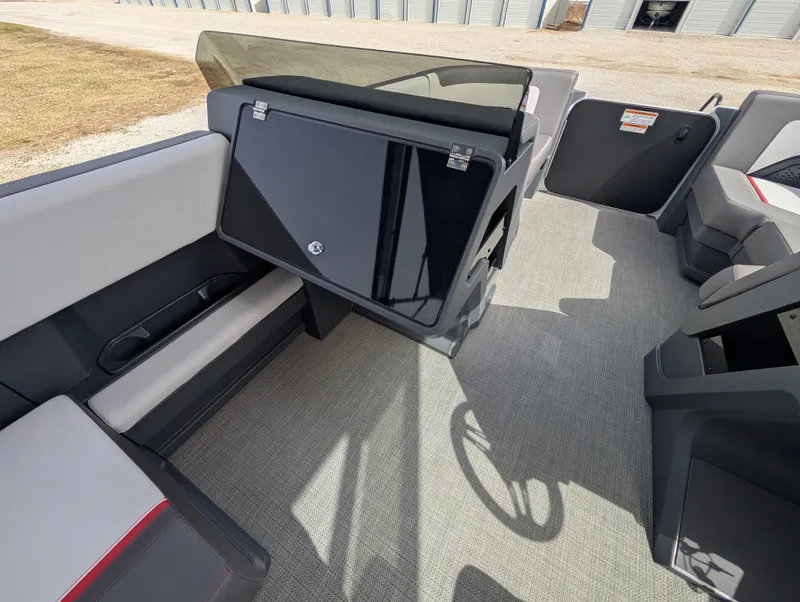 Slide: The Image of 2025 Manitou Cruise boat interior with modern seating and sleek dashboard design. - 20