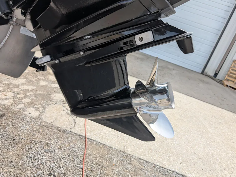 Slide: The Image of 2025 Manitou Cruise boat propeller, shiny metal finish, outdoor setting. - 40