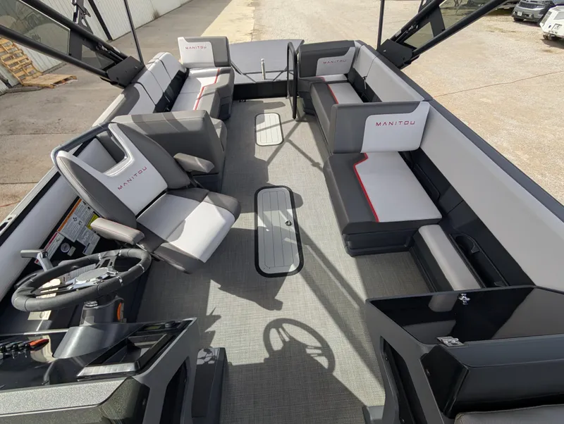 Slide: The Image of 2025 Manitou Cruise boat interior with modern seating and steering wheel. - 45