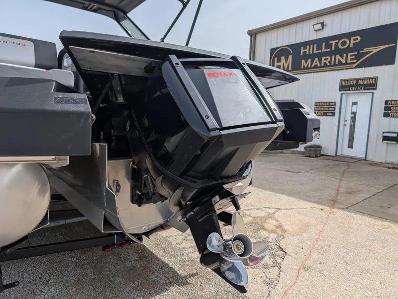 Slide: The Image of 2025 Manitou Cruise boat engine at Hilltop Marine dealership. - 8