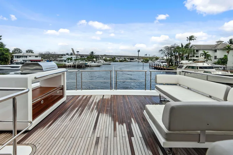 Slide: The Image of Azimut 72 Flybridge 2017 yacht deck with seating and waterfront view. - 19