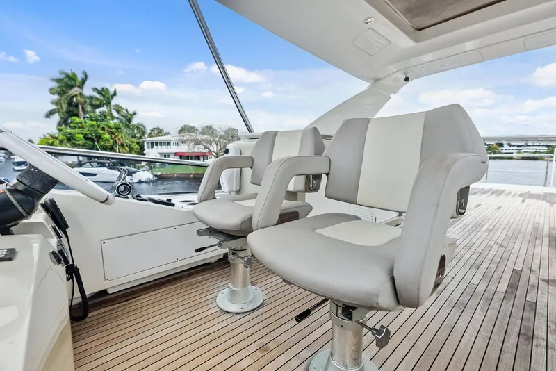 Slide: The Image of Luxury seating on 2017 Azimut 72 Flybridge yacht, featuring sleek design and waterfront view. - 20