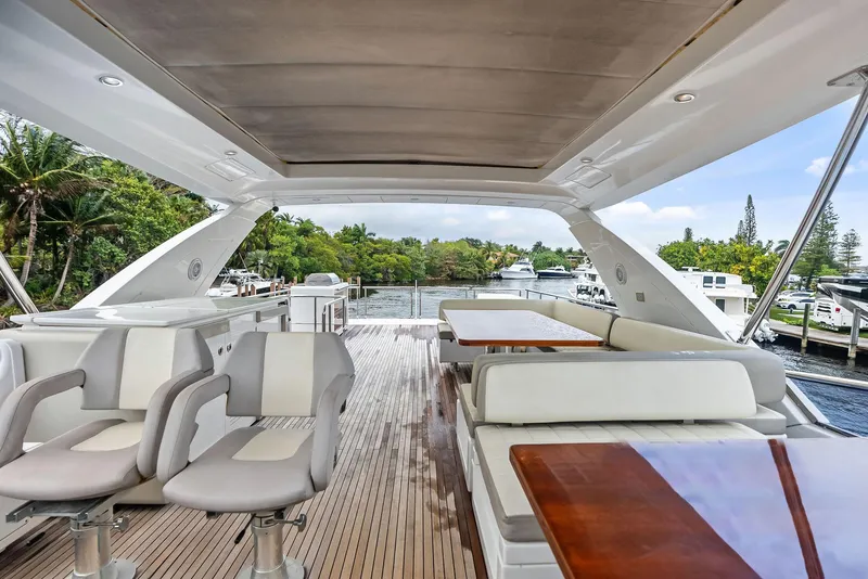 Slide: The Image of 2017 Azimut 72 Flybridge yacht interior with seating and dining area. - 24