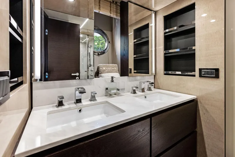 Slide: The Image of Luxurious bathroom in 2017 Azimut 72 Flybridge yacht with dual sinks and modern fixtures. - 45