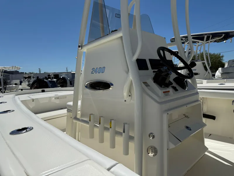 Slide: The Image of 2025 Pathfinder 2400 Open boat console with steering wheel and rod holders. - 5
