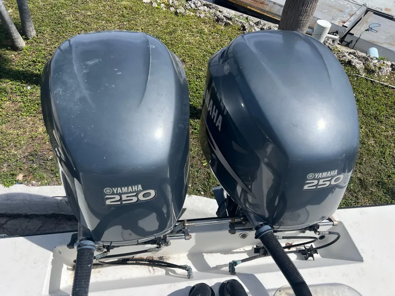 Slide: The Image of Twin Yamaha 250 outboard engines on a 1999 Contender 35 Center Console boat. - 10