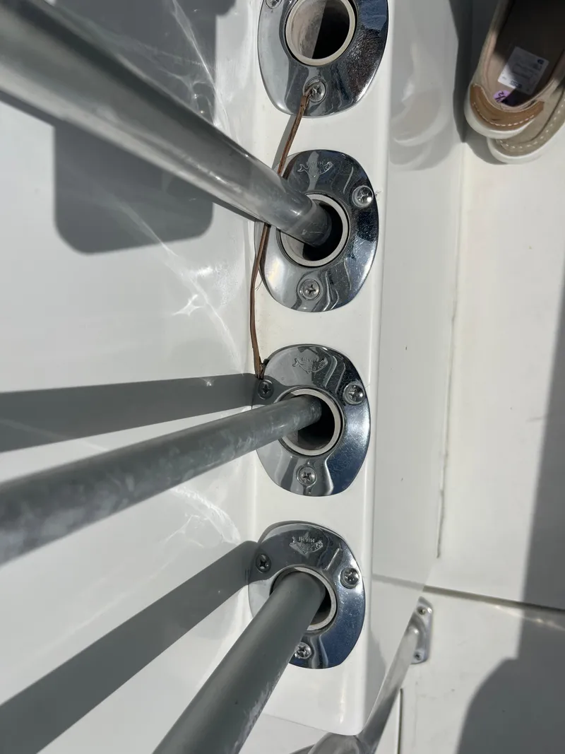 Slide: The Image of Close-up of rod holders on a 1999 Contender 35 Center Console boat. - 11