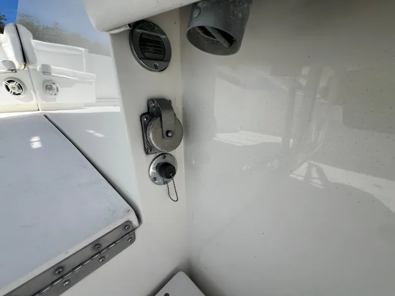 Slide: The Image of 1999 Contender 35 Center Console boat interior, featuring control panel and cuddy cabin details. - 18