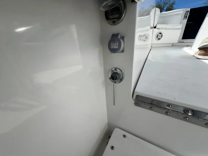 Slide: The Image of 1999 Contender 35 Center Console interior, featuring control panel and seating area. - 19