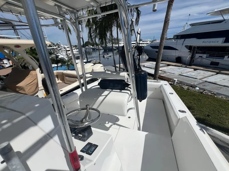 Slide: The Image of 1999 Contender 35 Center Console with Forward Cuddy, docked at marina, sunny day. - 22