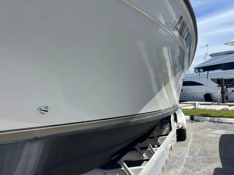 Slide: The Image of 1999 Contender 35 Center Console boat on trailer, side view. - 3