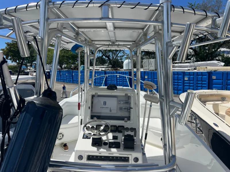 Slide: The Image of 1999 Contender 35 Center Console boat with forward cuddy, featuring helm and controls. - 30