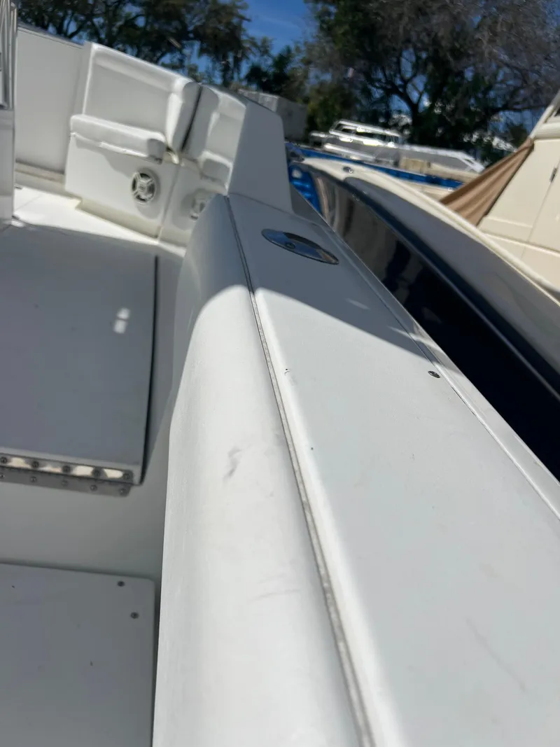 Slide: The Image of 1999 Contender 35 Center Console with Forward Cuddy, white interior, sunny day. - 31
