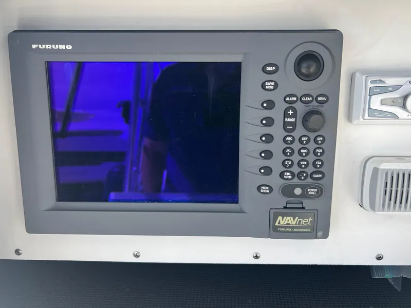 Slide: The Image of Furuno NAVnet display on 1999 Contender 35 Center Console boat dashboard. - 48