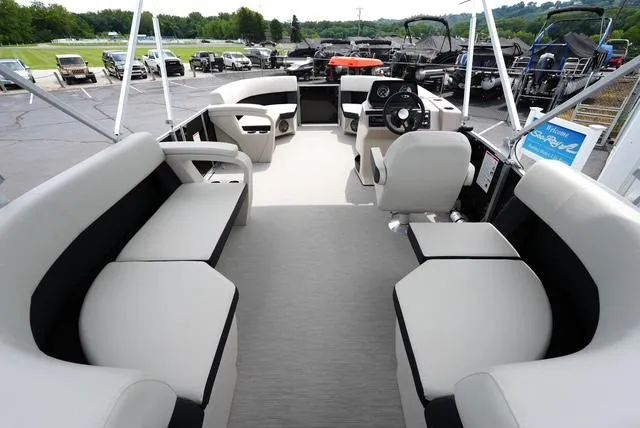 Slide: The Image of 2025 Harris Breeze 210 pontoon boat interior with spacious seating and modern design. - 11
