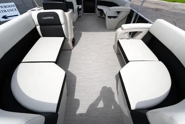 Slide: The Image of 2025 Harris Breeze 210 pontoon boat interior with spacious seating and modern design. - 8