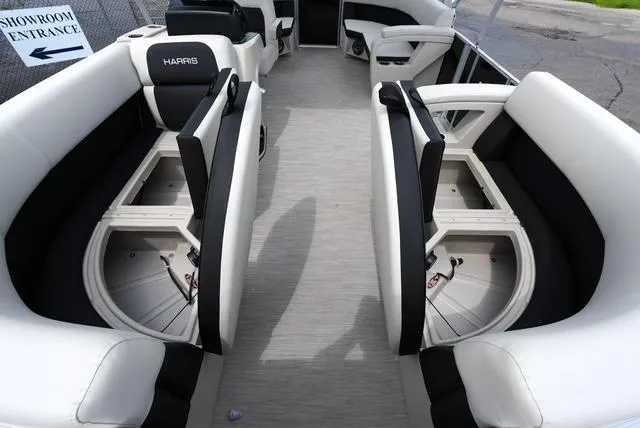 Slide: The Image of 2025 Harris Breeze 210 boat interior with spacious seating and storage compartments. - 9