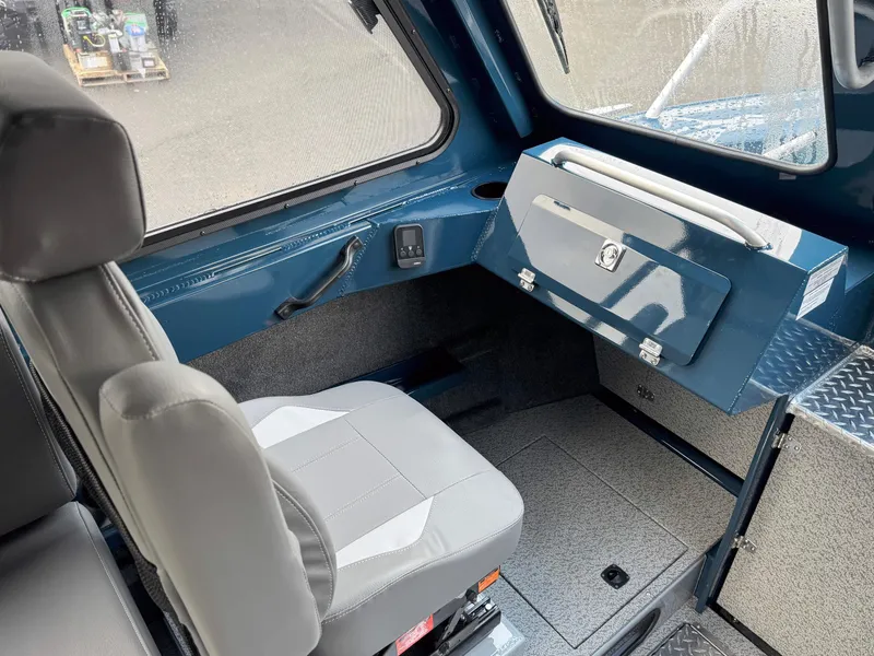 Slide: The Image of Interior of 2025 Hewescraft 270 Alaskan ET HT boat, featuring seating and storage. - 4