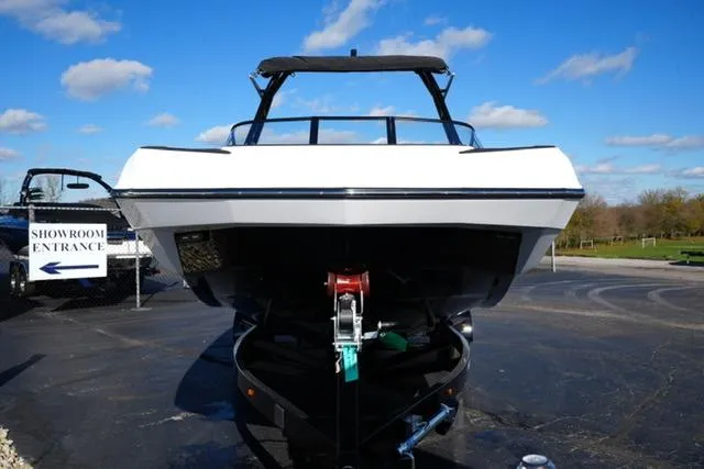 Slide: The Image of 2025 Moomba Max boat on trailer, front view, outdoors, clear sky. - 13