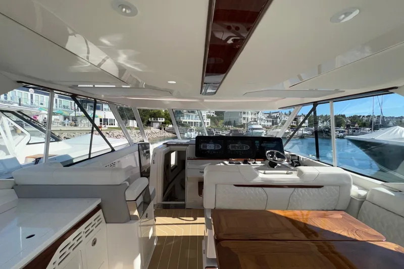 Slide: The Image of Luxurious interior of 2026 Regal LX43 yacht with modern helm and seating area. - 16