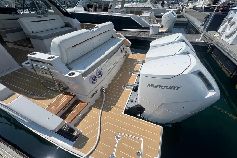 Slide: The Image of Luxury Regal LX43 boat with triple Mercury engines, 2026 model, docked at marina. - 6