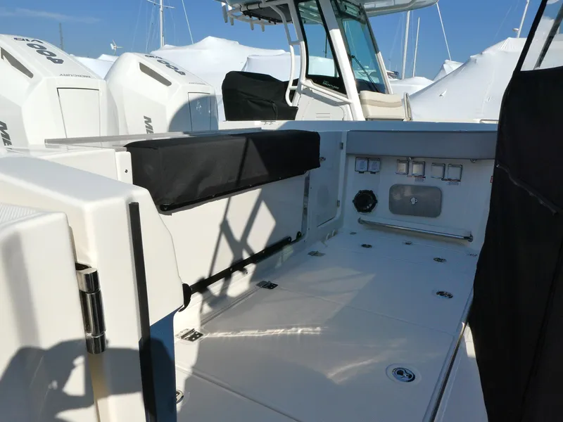 Slide: The Image of 2025 Boston Whaler 330 Vantage boat deck with seating and storage features. - 17