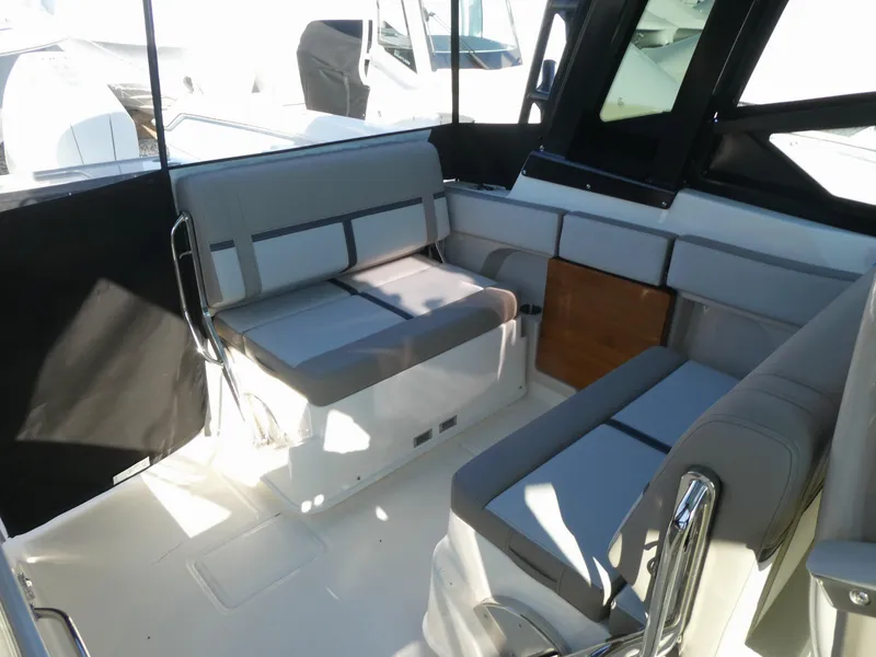 Slide: The Image of 2025 Boston Whaler 330 Vantage interior with gray seating and modern design. - 5