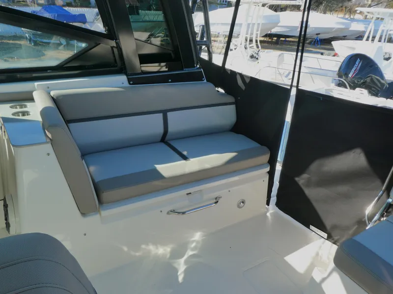 Slide: The Image of 2025 Boston Whaler 330 Vantage interior seating with modern design and comfortable upholstery. - 6