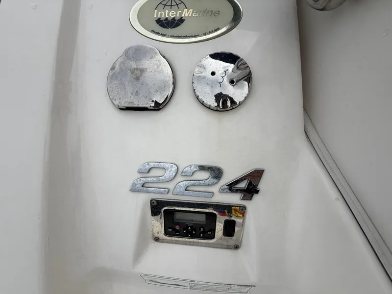 Slide: The Image of 2015 Chaparral Sunesta 224 boat emblem and control panel. - 17