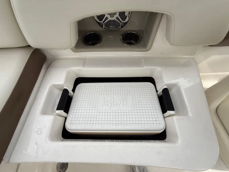 Slide: The Image of 2015 Chaparral Sunesta 224 boat interior with Igloo cooler and cup holders. - 27