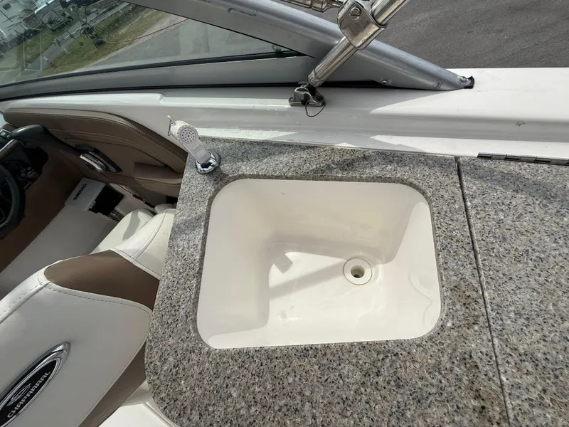 Slide: The Image of 2015 Chaparral Sunesta 224 boat interior with granite countertop and built-in sink. - 29
