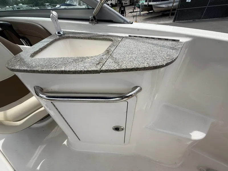 Slide: The Image of 2015 Chaparral Sunesta 224 boat interior with granite countertop and sink. - 30