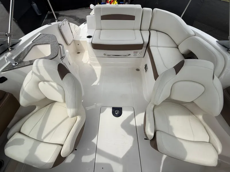Slide: The Image of 2015 Chaparral Sunesta 224 boat interior with white seating and modern design. - 35
