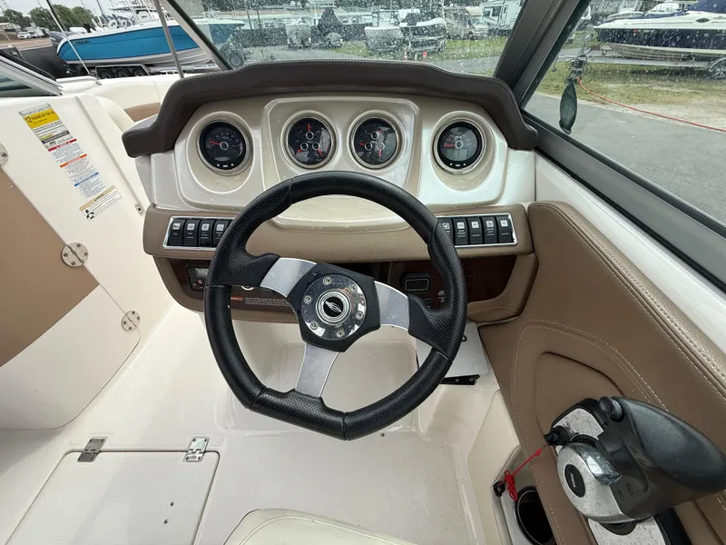 Slide: The Image of 2015 Chaparral Sunesta 224 dashboard with steering wheel and gauges. - 37