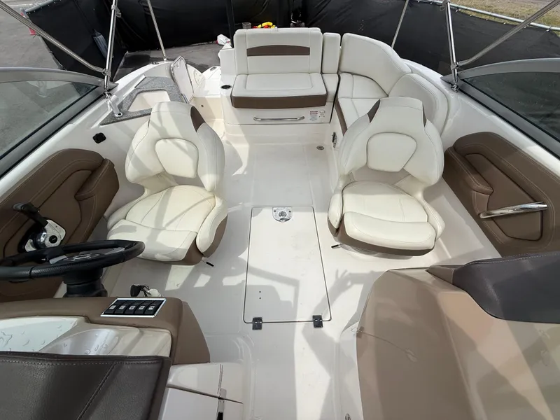 Slide: The Image of 2015 Chaparral Sunesta 224 boat interior with white and brown seating arrangement. - 45