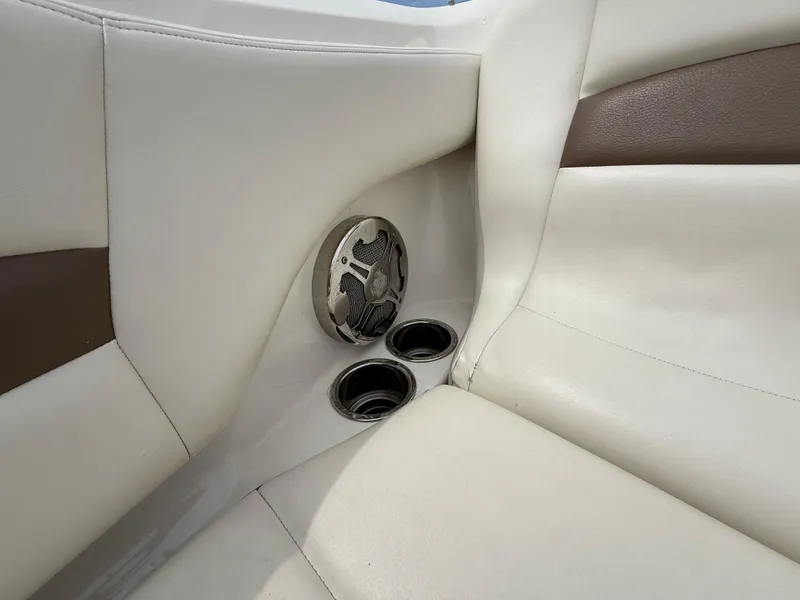 Slide: The Image of 2015 Chaparral Sunesta 224 boat interior with speaker and cup holders. - 54