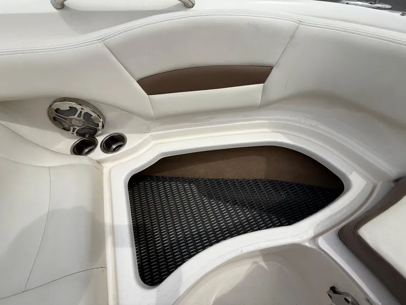 Slide: The Image of 2015 Chaparral Sunesta 224 boat interior with speaker and cup holders. - 59