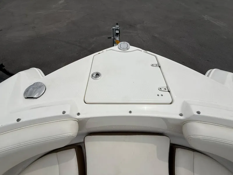 Slide: The Image of 2015 Chaparral Sunesta 224 boat bow with storage compartment and seating. - 63