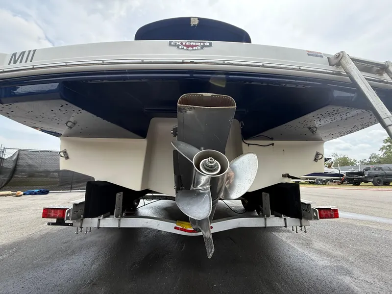 Slide: The Image of Rear view of a 2015 Chaparral Sunesta 224 boat on a trailer. - 7