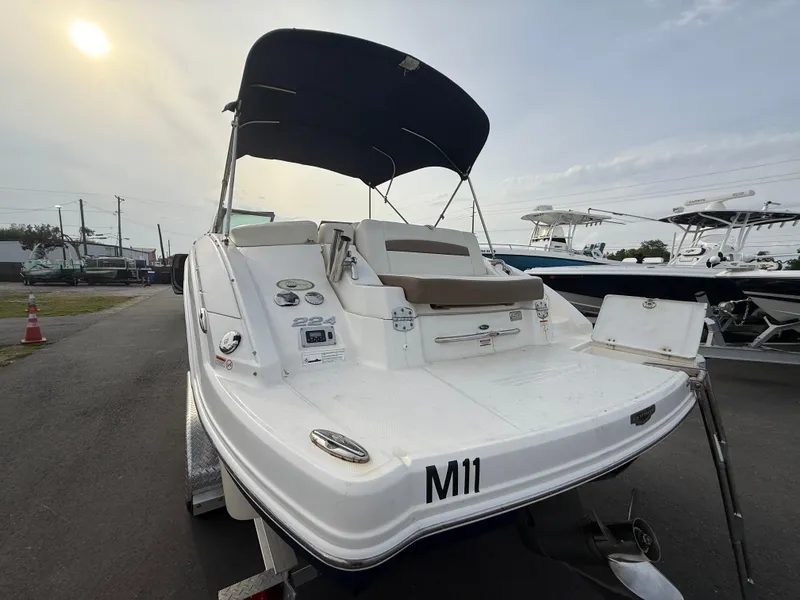 Slide: The Image of 2015 Chaparral Sunesta 224 boat with canopy on trailer, rear view. - 8