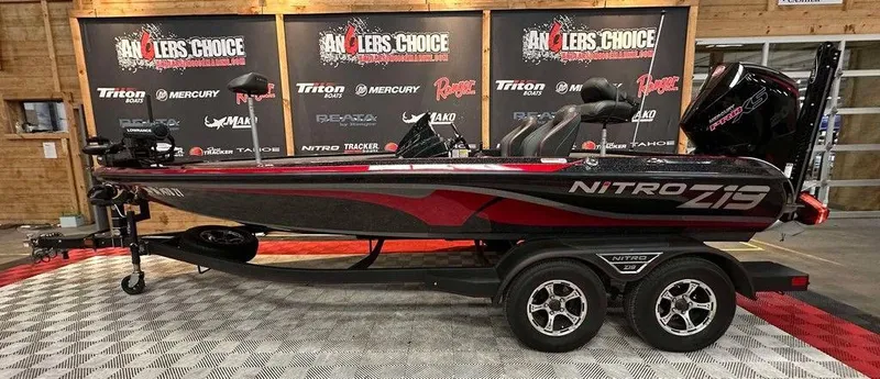Slide: The Image of 2023 Nitro Z19 Pro bass boat on display at Angler's Choice event. - 1
