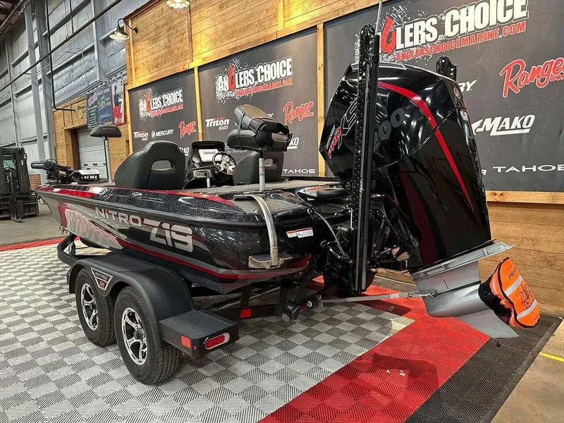 Slide: The Image of 2023 Nitro Z19 Pro boat displayed indoors with powerful engine and sleek design. - 3