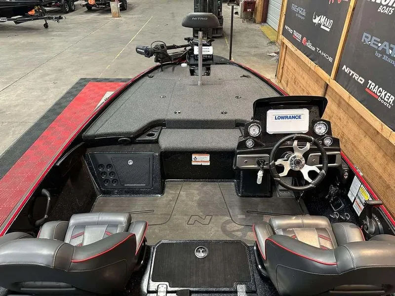 Slide: The Image of 2023 Nitro Z19 Pro boat interior with steering wheel and Lowrance display. - 5