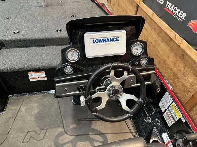 Slide: The Image of 2023 Nitro Z19 Pro boat dashboard with Lowrance display and steering wheel. - 7