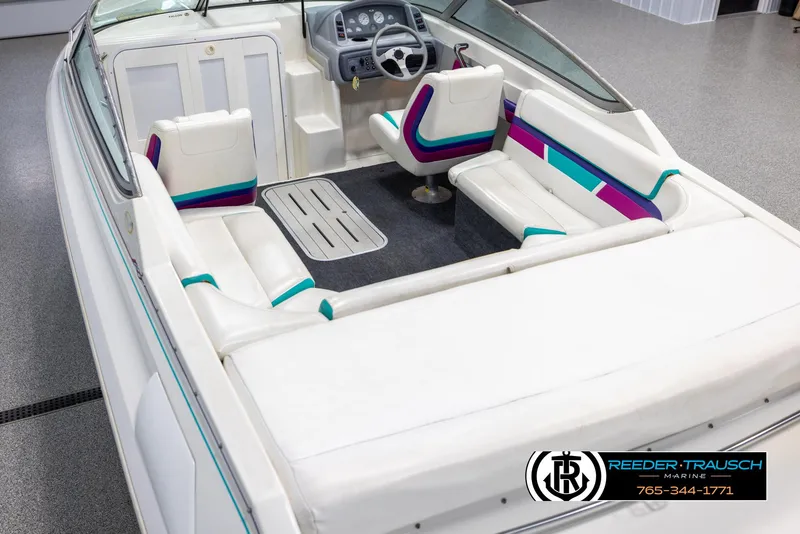 Slide: The Image of 1996 Thunderbird Falcon 2270 CD boat interior with white and colorful seating. - 10