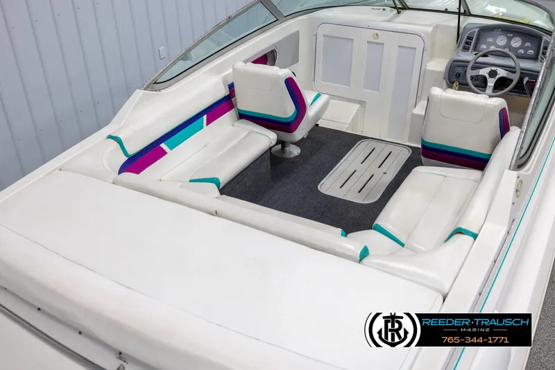 Slide: The Image of 1996 Thunderbird Falcon 2270 CD boat interior with colorful seating and steering console. - 11